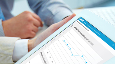 IVANS index: Premium Renewal Rate Index Men in business attire working on a tablet